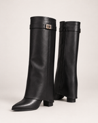 Women's black knee high boots pair with low block heels
