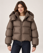 Women's brown puffer jacket with oversized hood front view