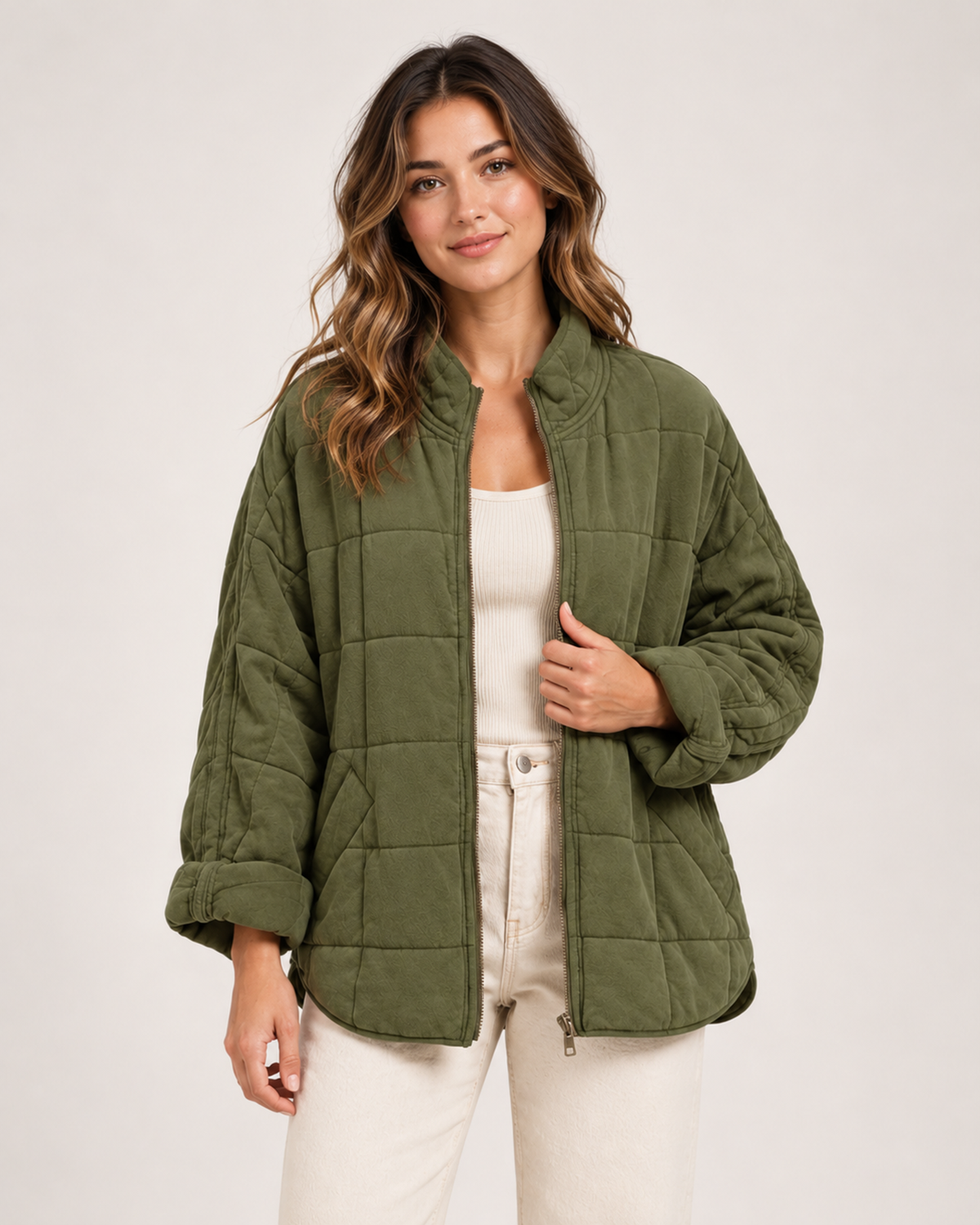 Women's green quilted zip up jacket front view