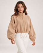 Women’s beige fleece jacket close movement view