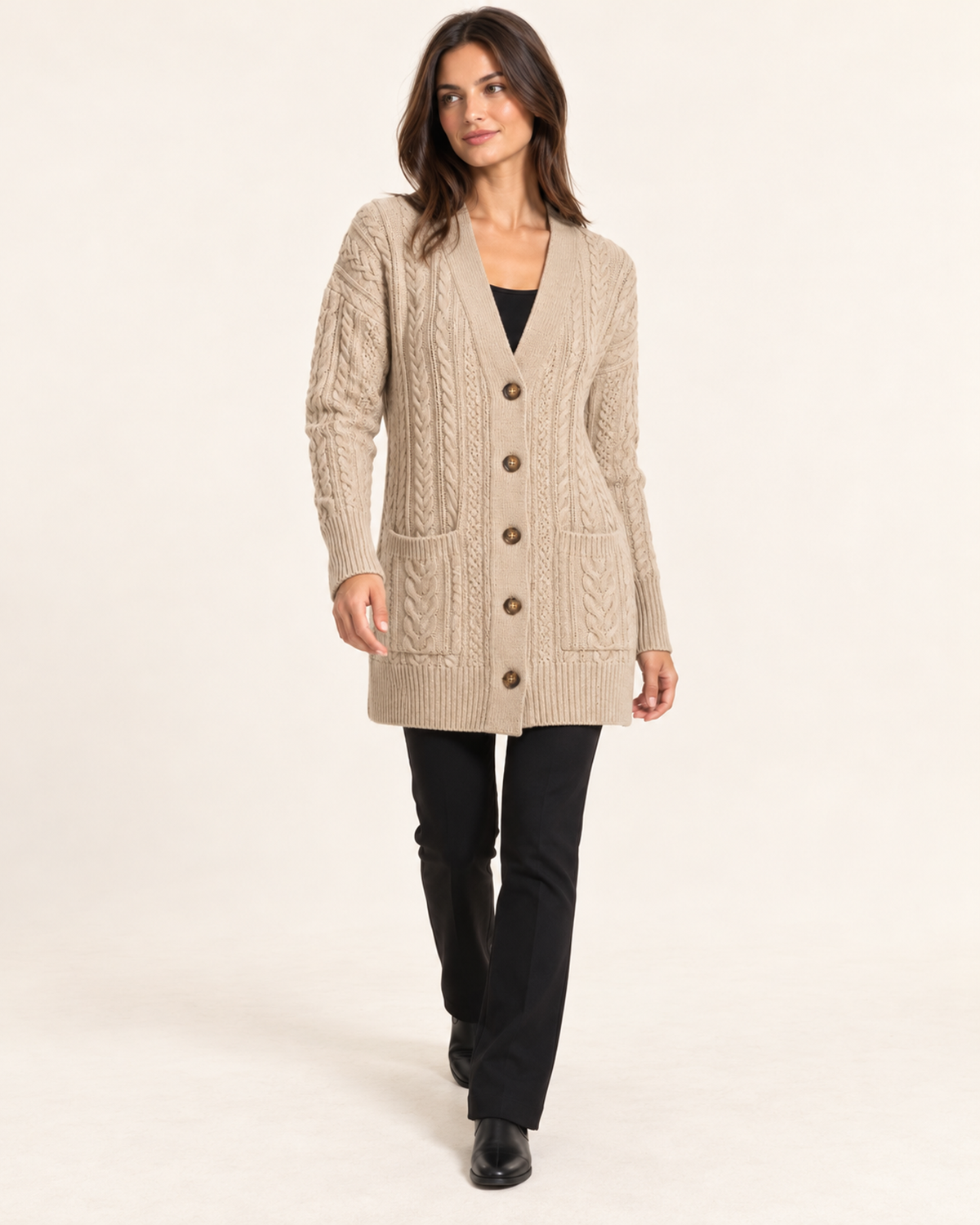Women's beige cable knit button front coatigan walking view