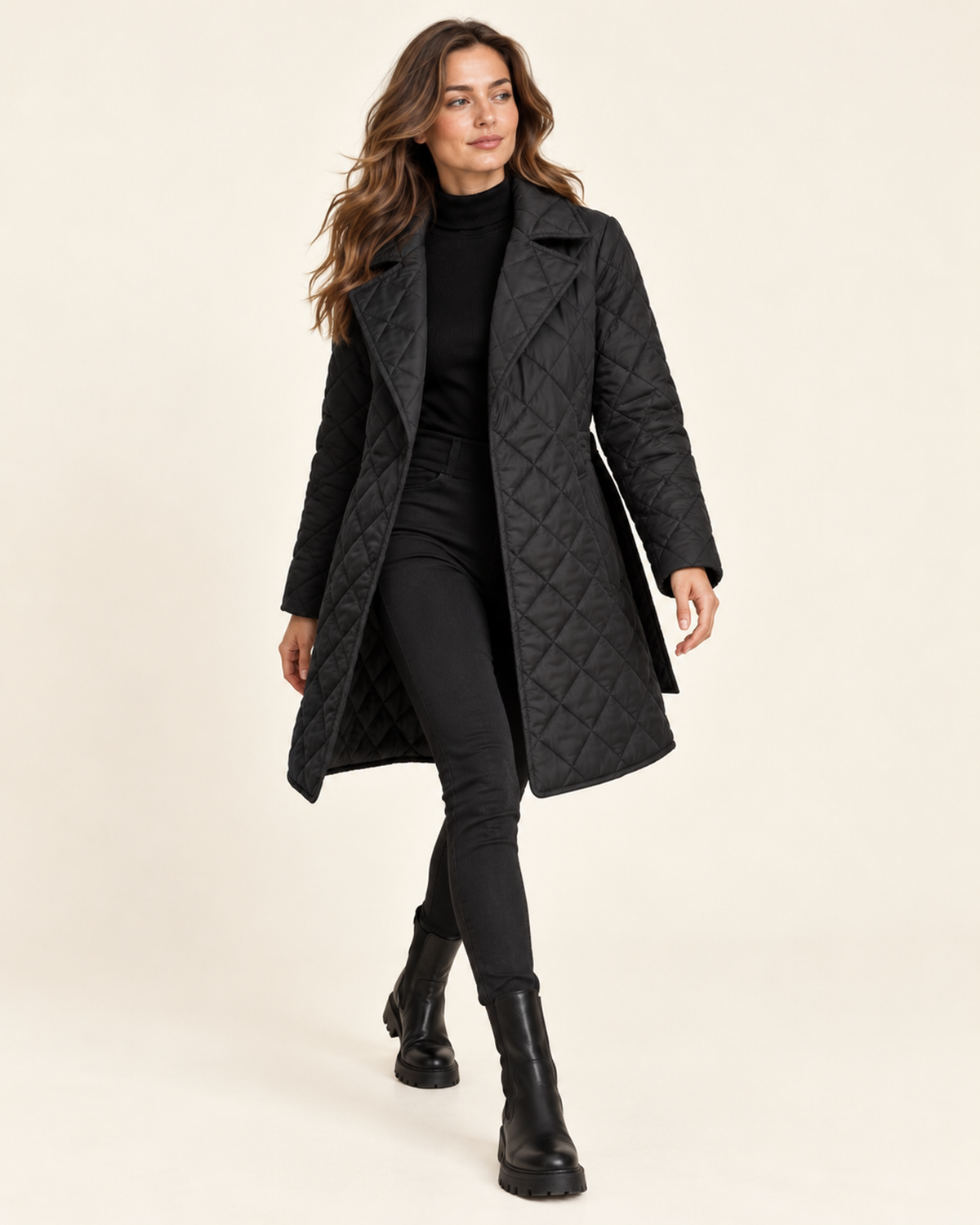 Women's black quilted belted lapel coat walking view