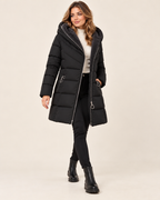 Women's black long puffer jacket with asymmetric zip walking view