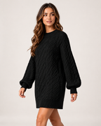 Women's black oversized cable knit jumper dress three-quarter view
