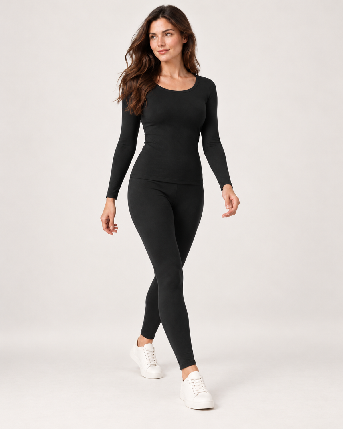Women's black thermal base layer set walking view