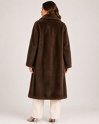 Women's brown long faux fur coat back view