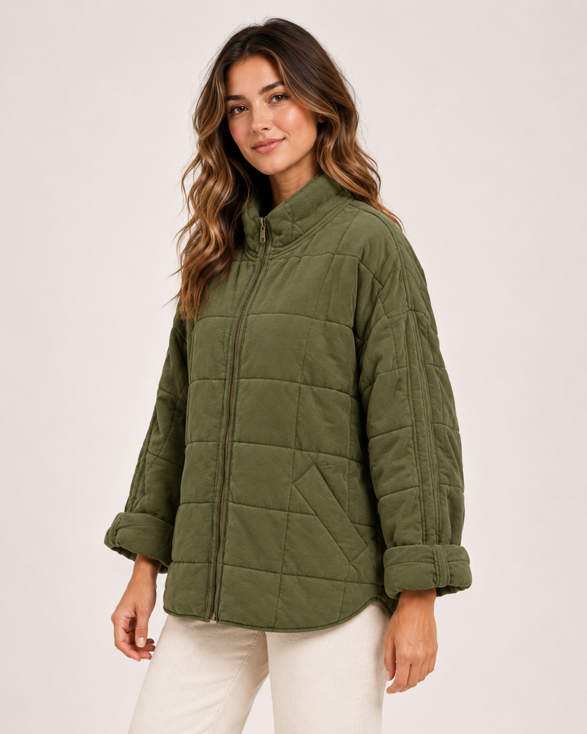 Women's green quilted zip up jacket closed three quarter view