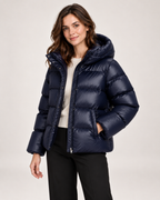 Women's blue hooded puffer jacket open three quarter view