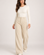 Women's light beige corduroy wide leg trousers walking view