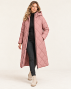 Women's pink long diamond quilted puffer jacket walking view