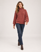Women's Cable Knit Jumper with Roll Neck and Balloon Sleeves walking view