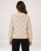 Women's beige polka dot sweater back view
