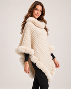 Women's beige cape coat with faux fur trim three quarter view