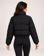 Women's black quilted cropped bomber jacket back view