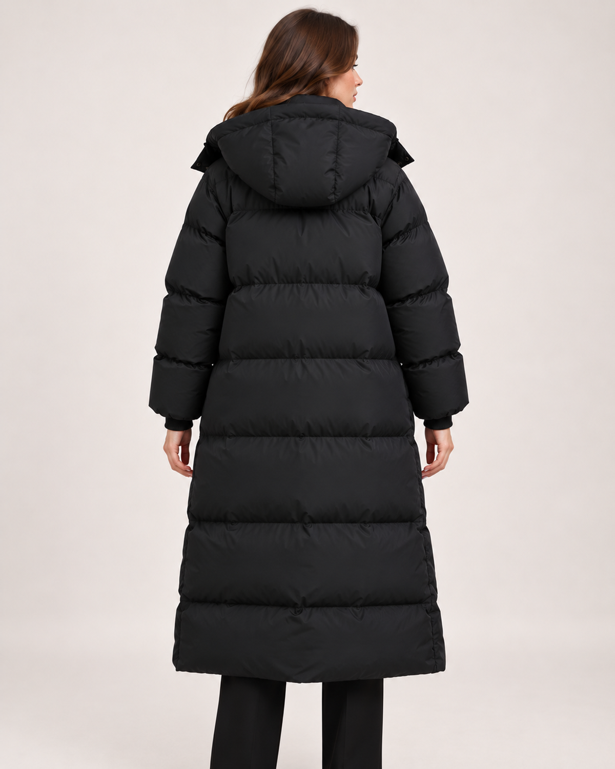 Women's black long hooded puffer coat back view