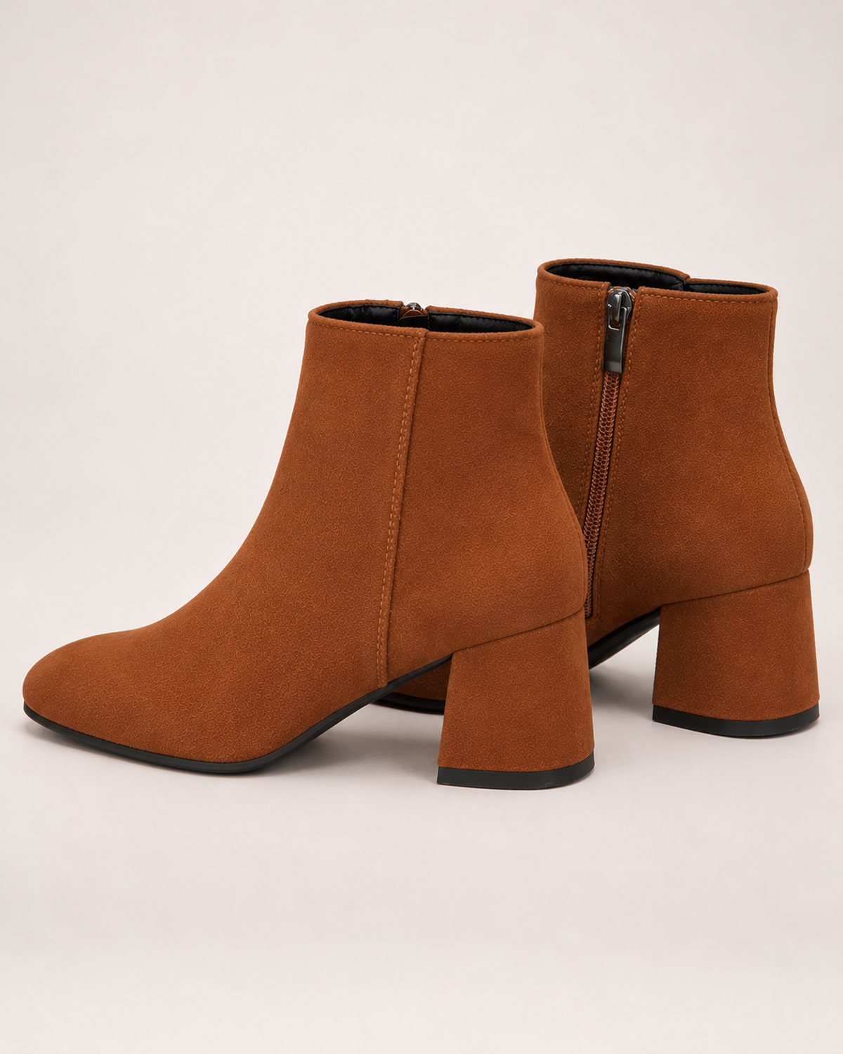 Women's brown suede ankle boots zip and heel view