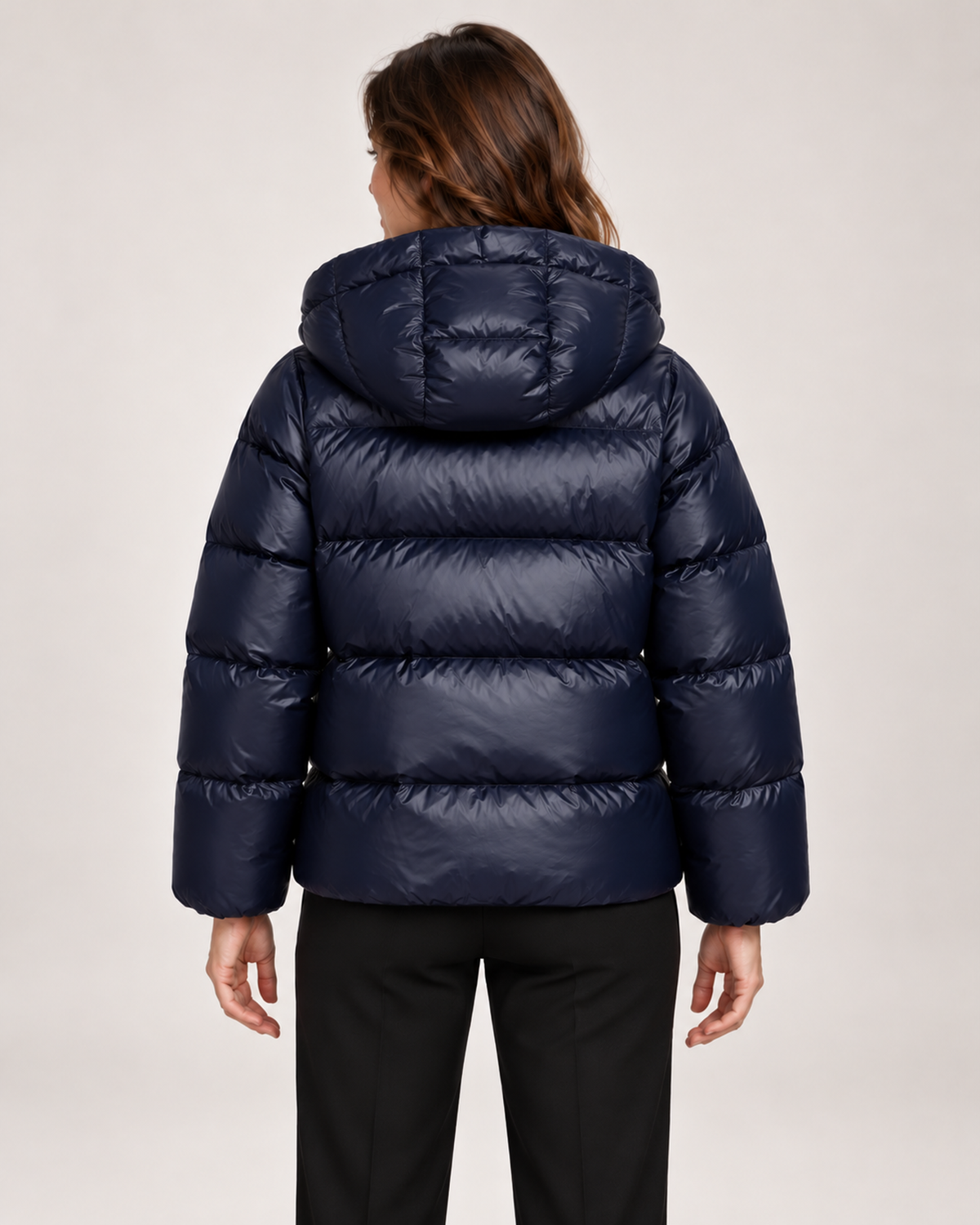 Women's blue hooded puffer jacket back view