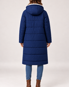 Back view of women's navy long hooded puffer coat