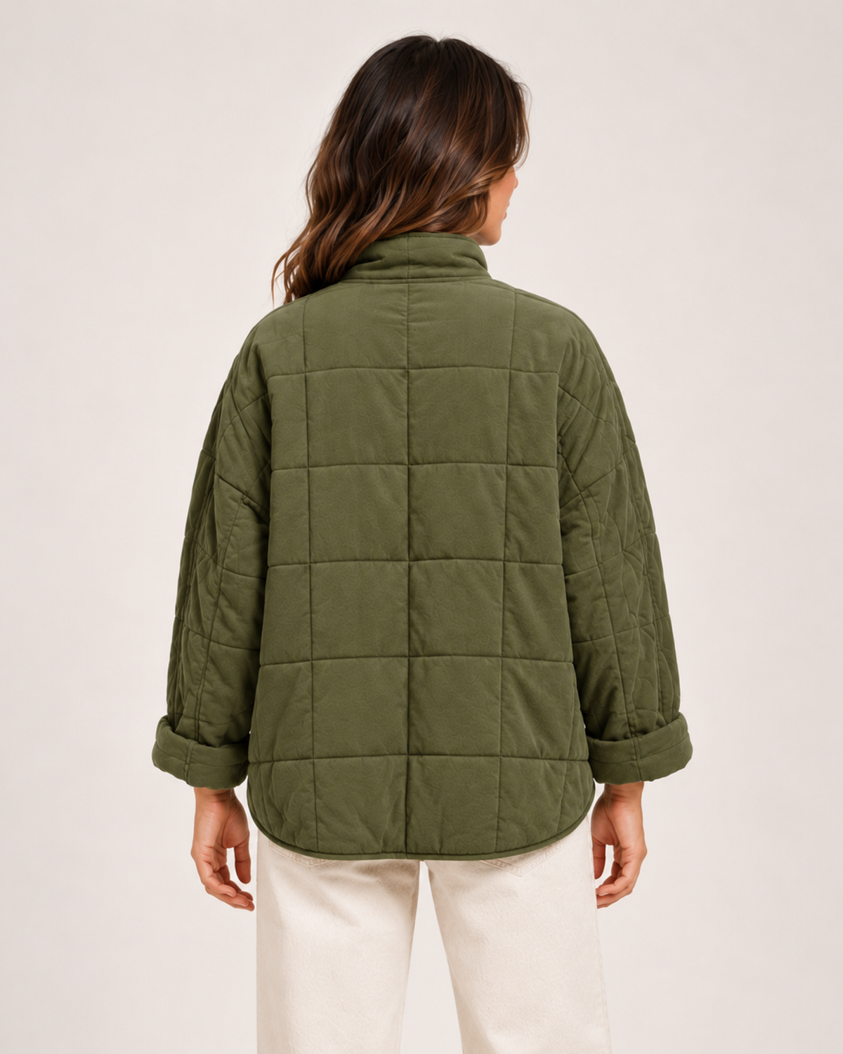 Women's green quilted zip up jacket back view