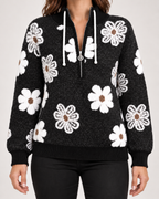 Women’s half-zip floral jumper – collar and pattern detail