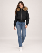 Women's black cropped puffer jacket full length styling view