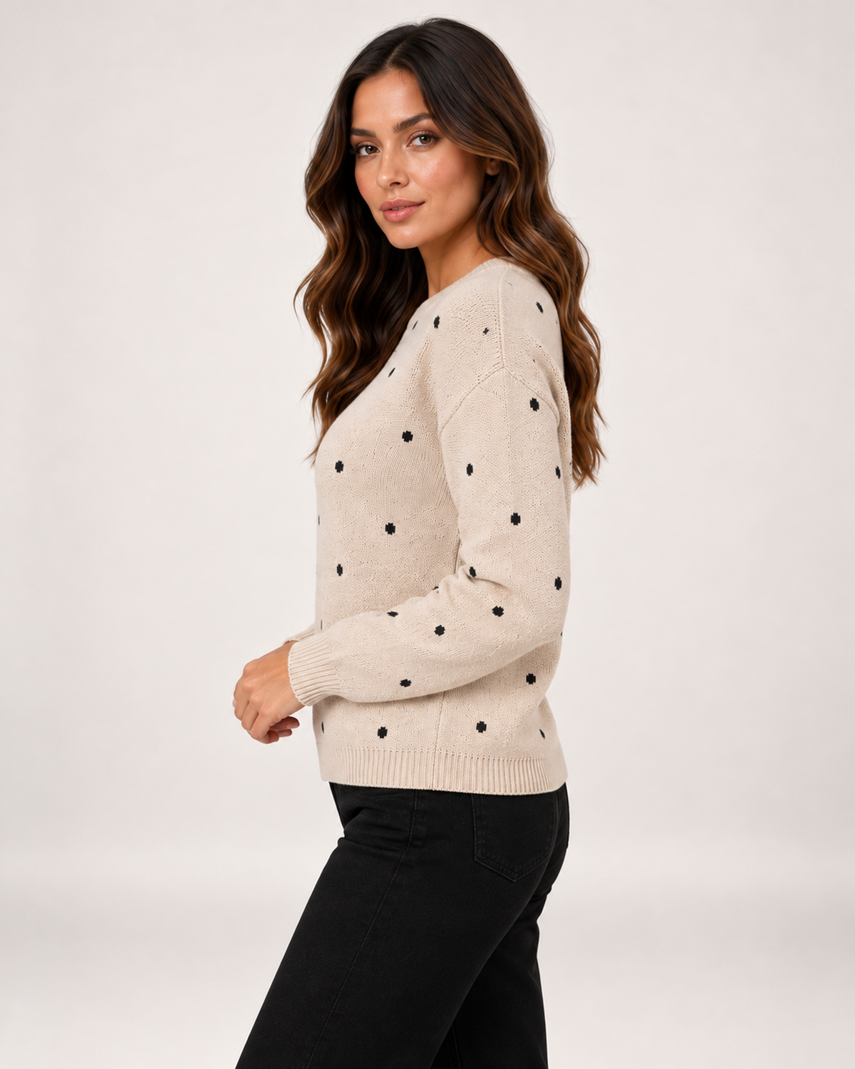 Women's beige polka dot sweater side view