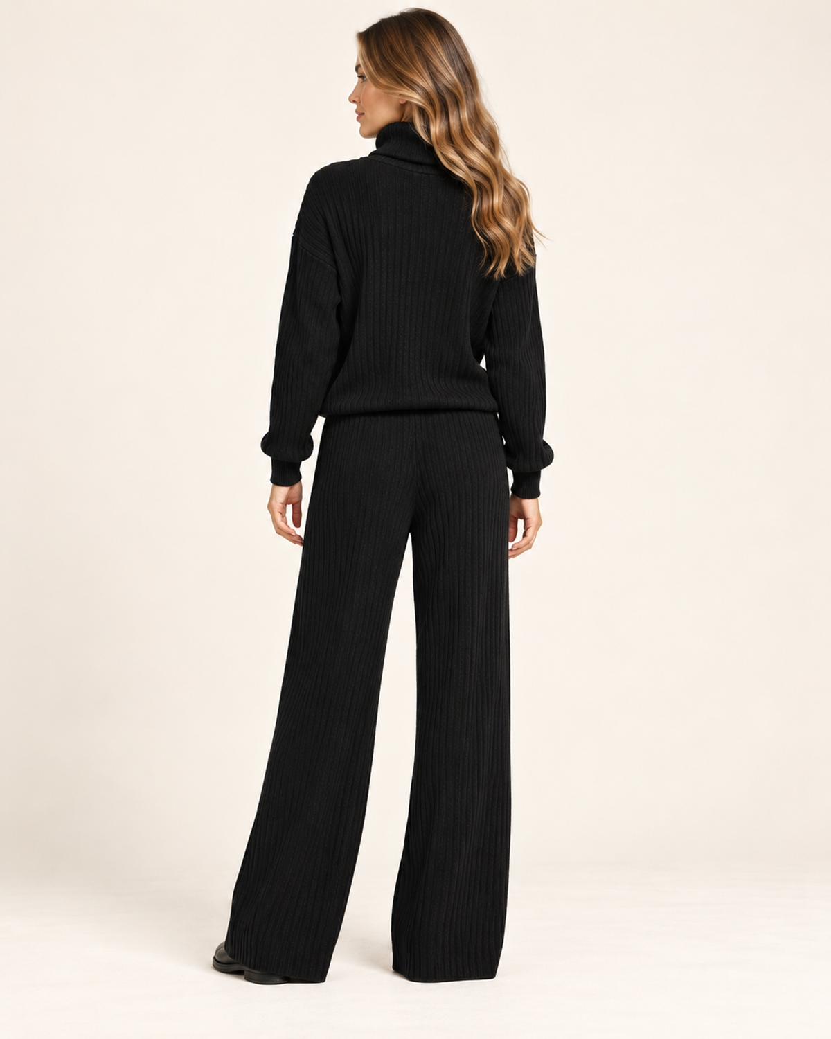 Women's black knitted roll neck co-ord set back view