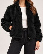 Women’s black fleece jacket funnel neck zip and hem detail
