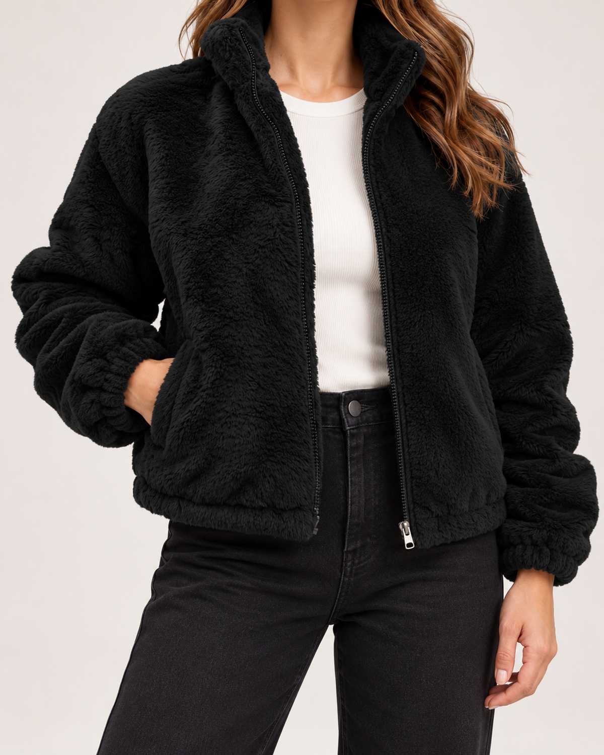 Women’s black fleece jacket funnel neck zip and hem detail