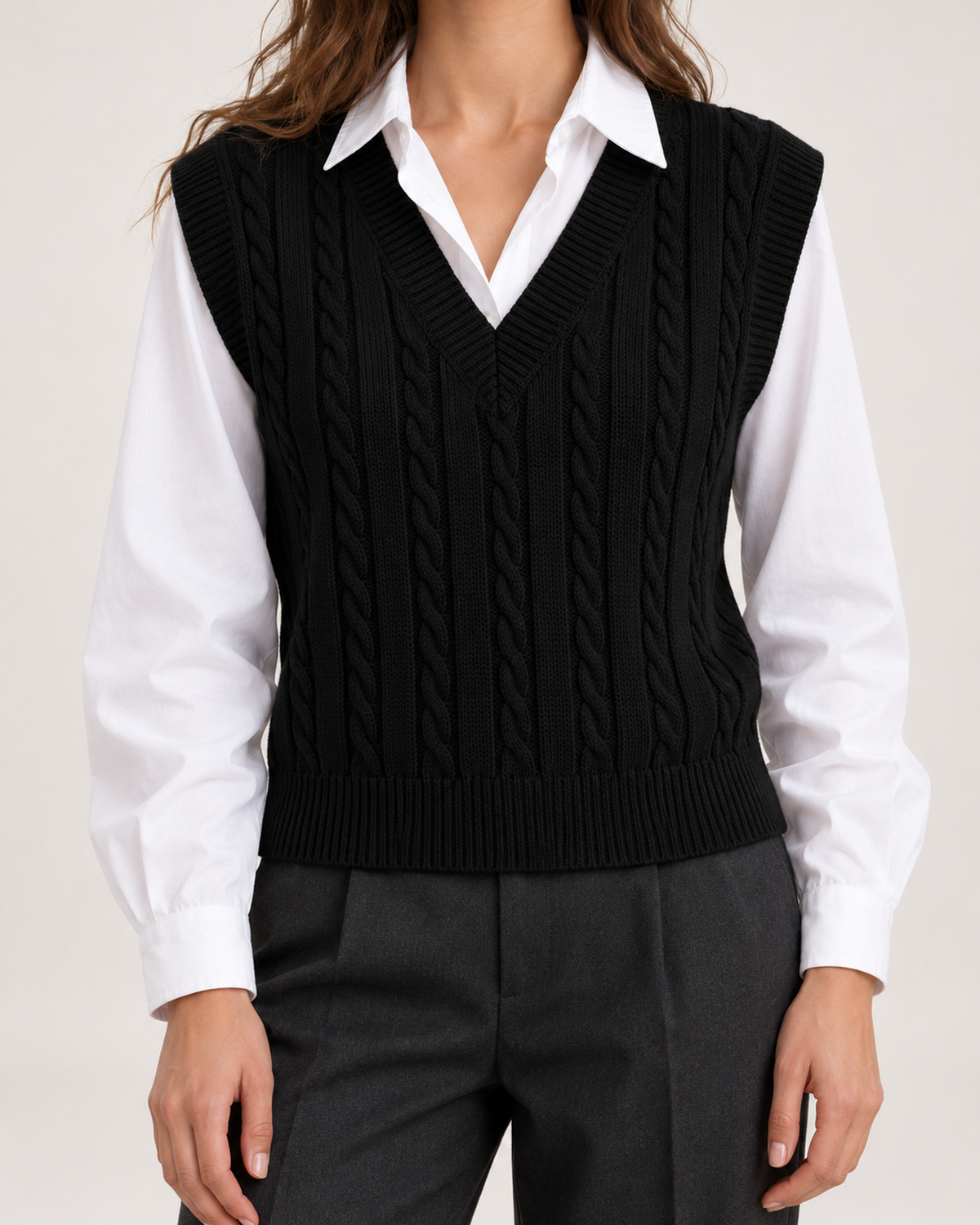 Women's black cable knit sweater vest neckline and cable detail