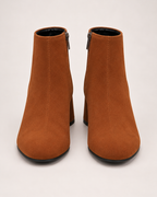 Women's brown suede heeled ankle boots front view