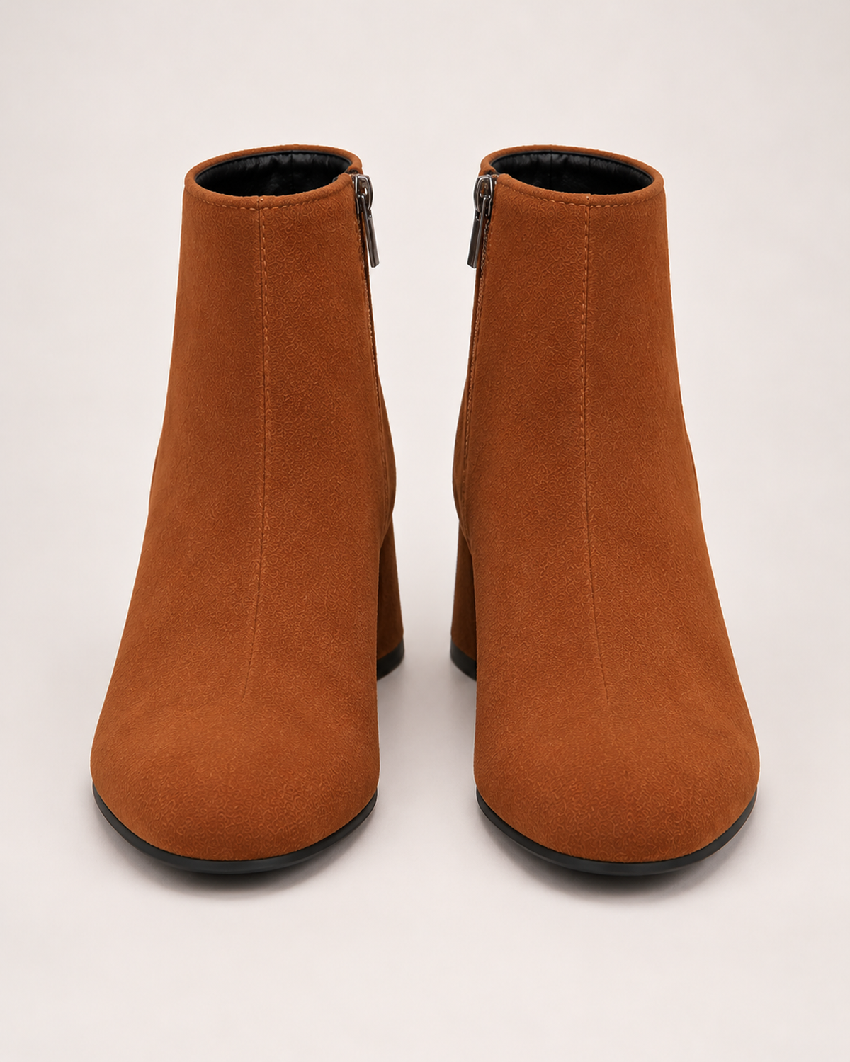 Women's brown suede heeled ankle boots front view