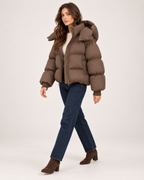 Women's brown puffer jacket with oversized hood full length styling view