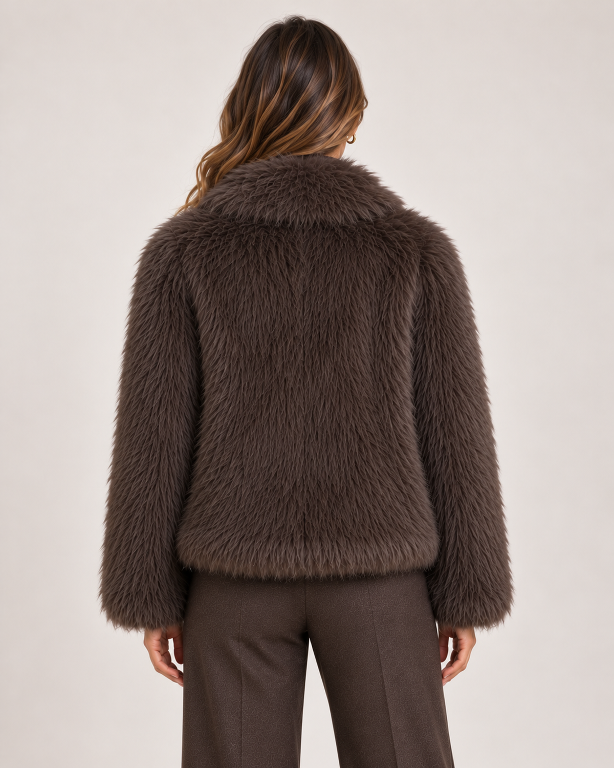 Back view of women's brown cropped faux fur jacket