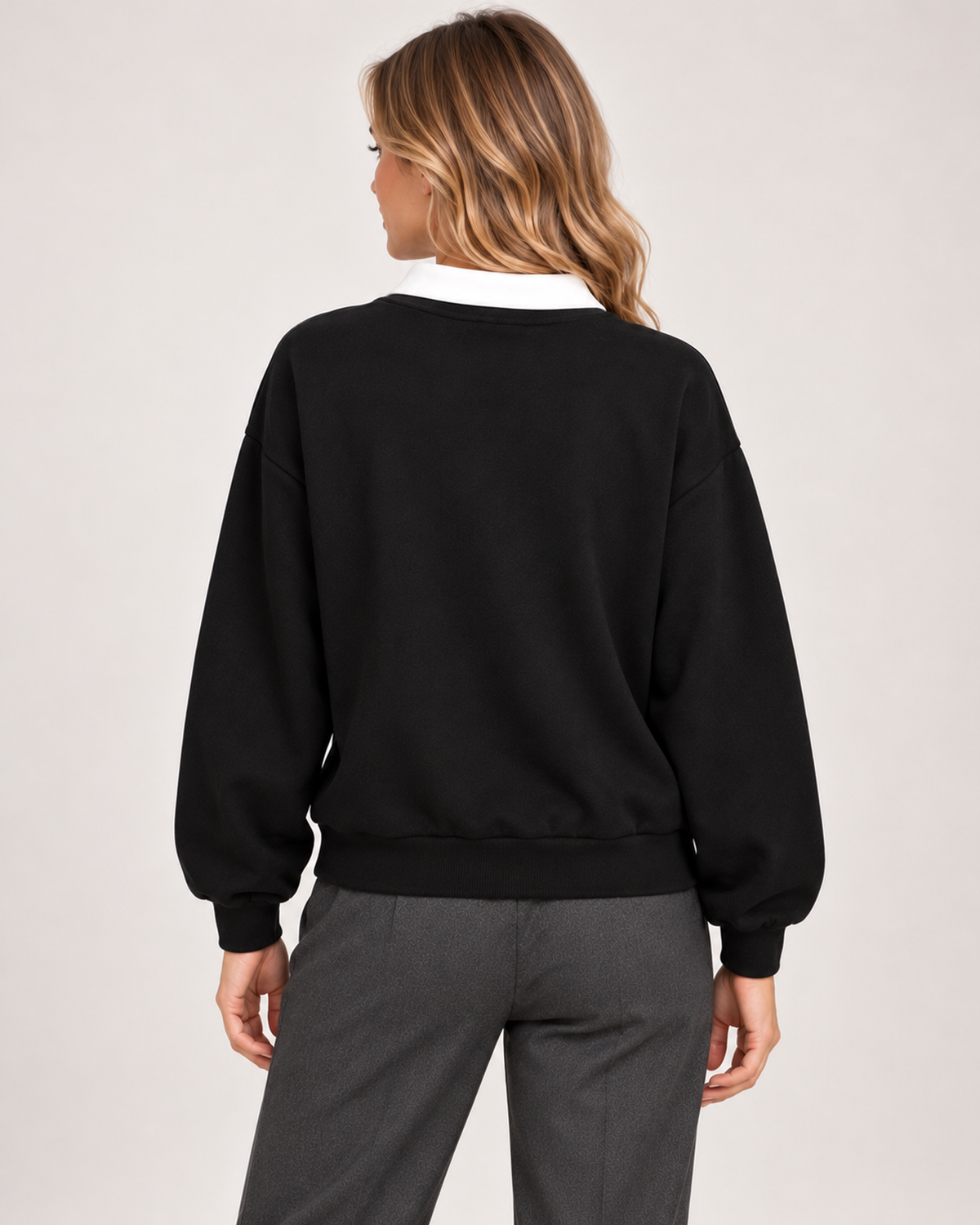 Back view of women's black collared jumper