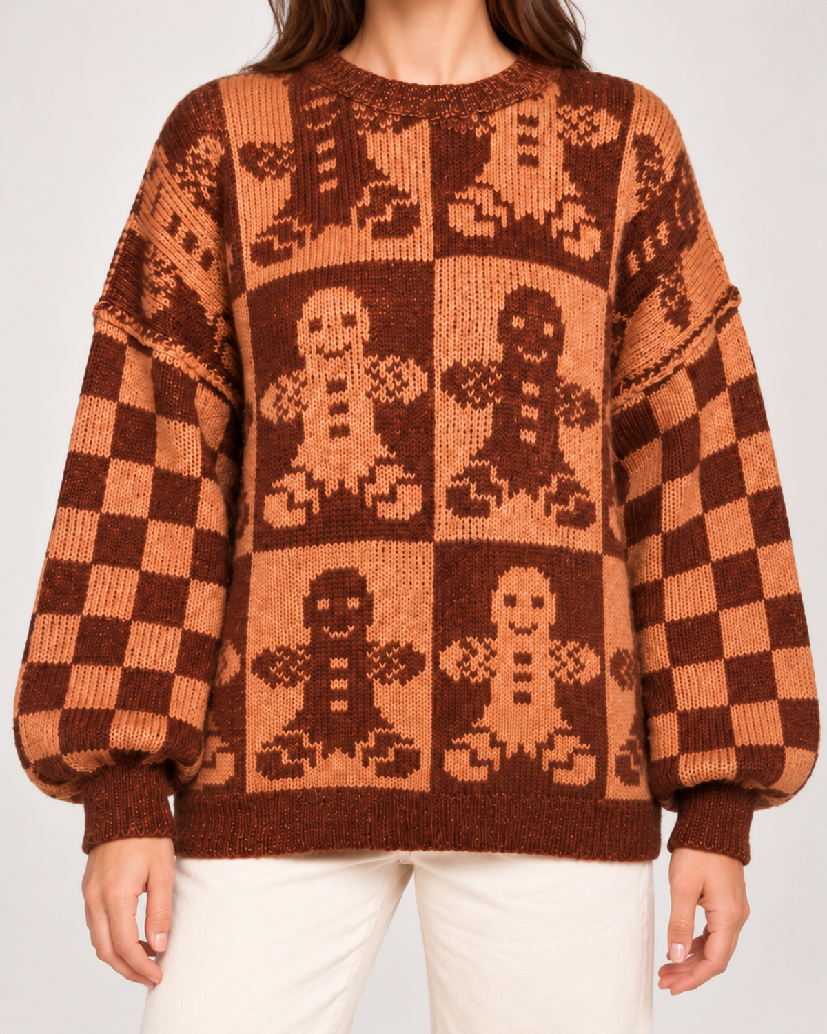 Close view of women's gingerbread Christmas jumper pattern and sleeves