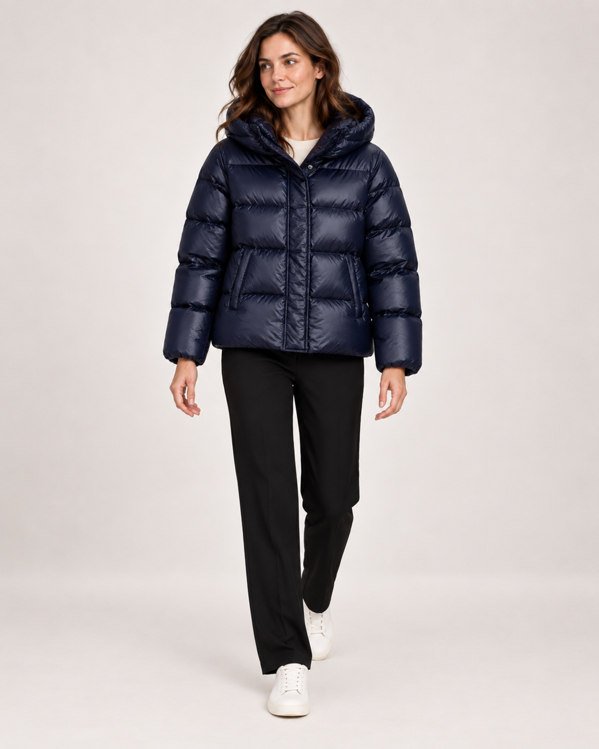 Women's blue hooded puffer jacket full length styling view