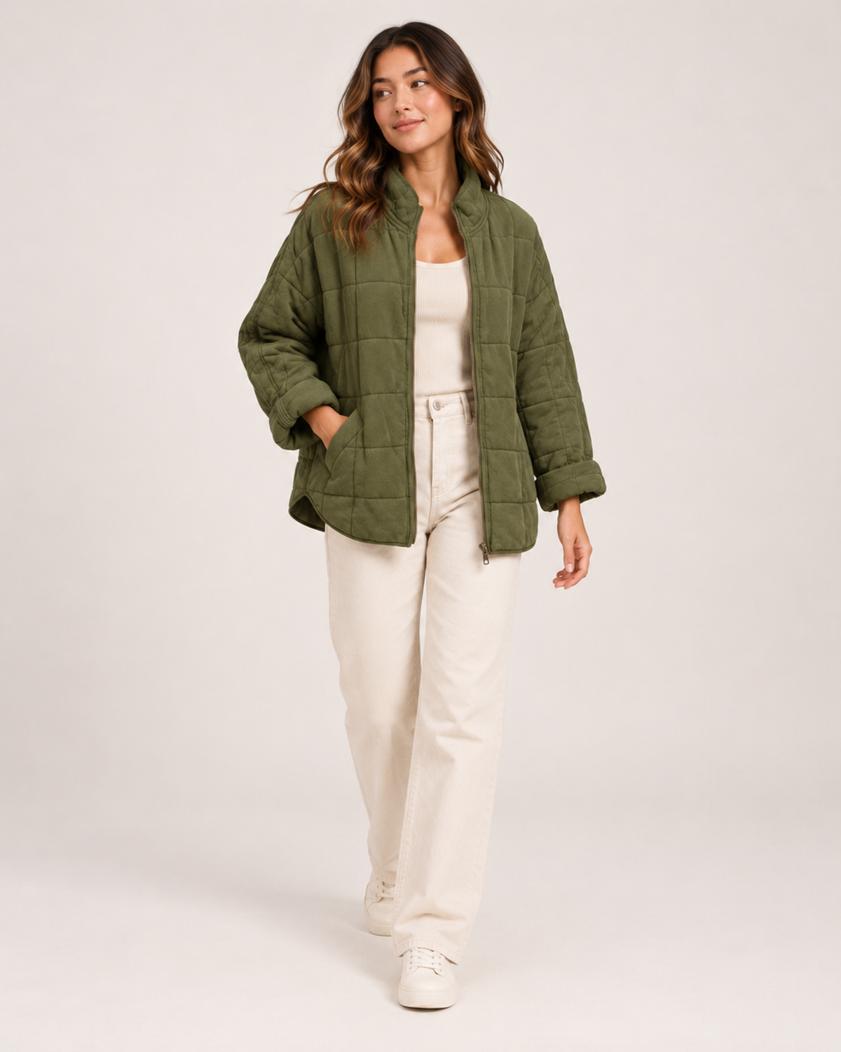 Women's green quilted zip up jacket full length styling view