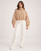 Women’s beige fleece jacket full body standing view