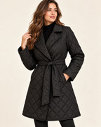 Women's black quilted belted lapel coat three quarter view