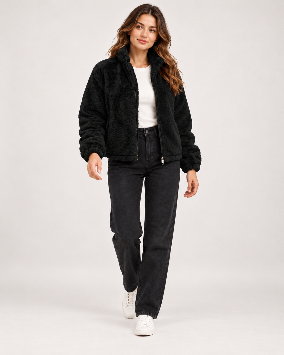 Women’s black fleece jacket full body walking view