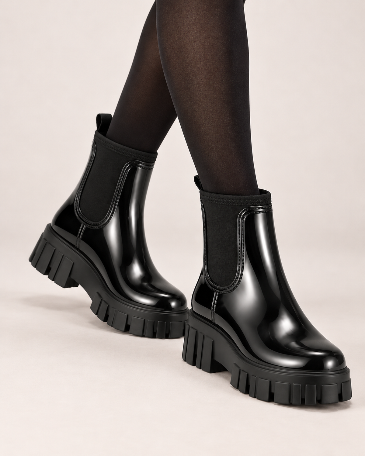 Women's black gloss Chelsea Wellington boots worn view