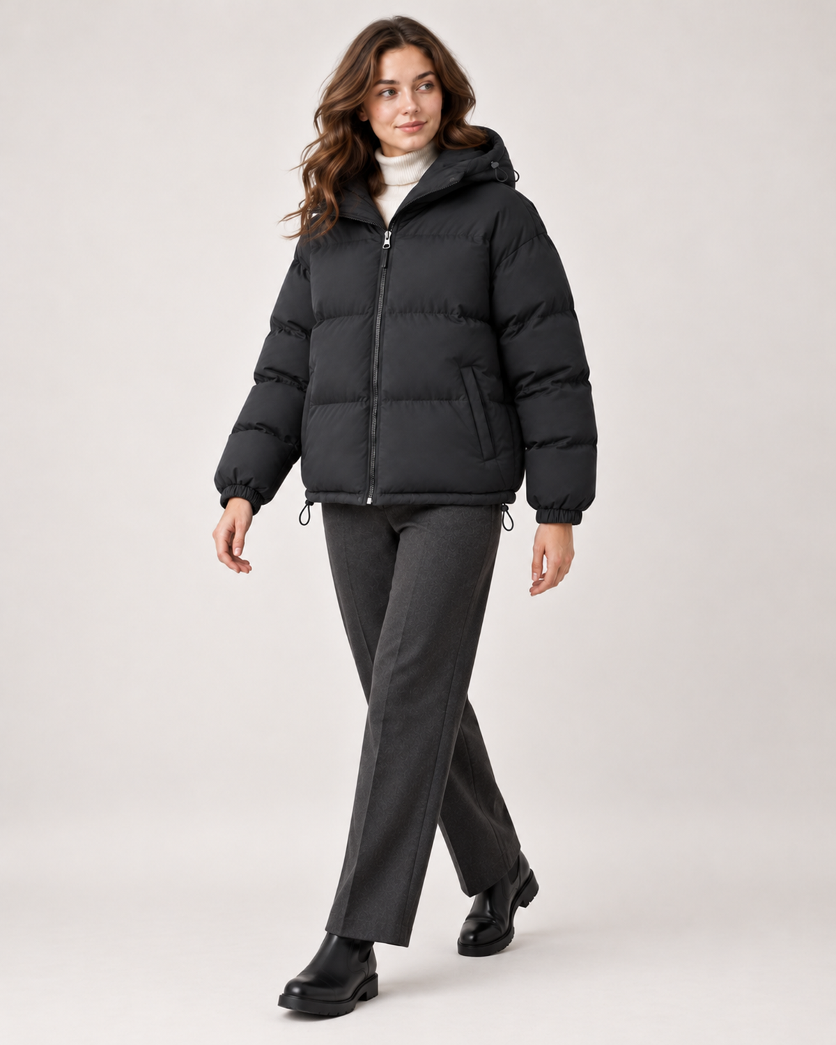 Women's black hooded puffer jacket full length styling view
