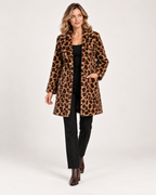 Women's brown leopard print coat styled with black trousers