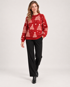 Women's red Christmas tree jumper styled with black trousers